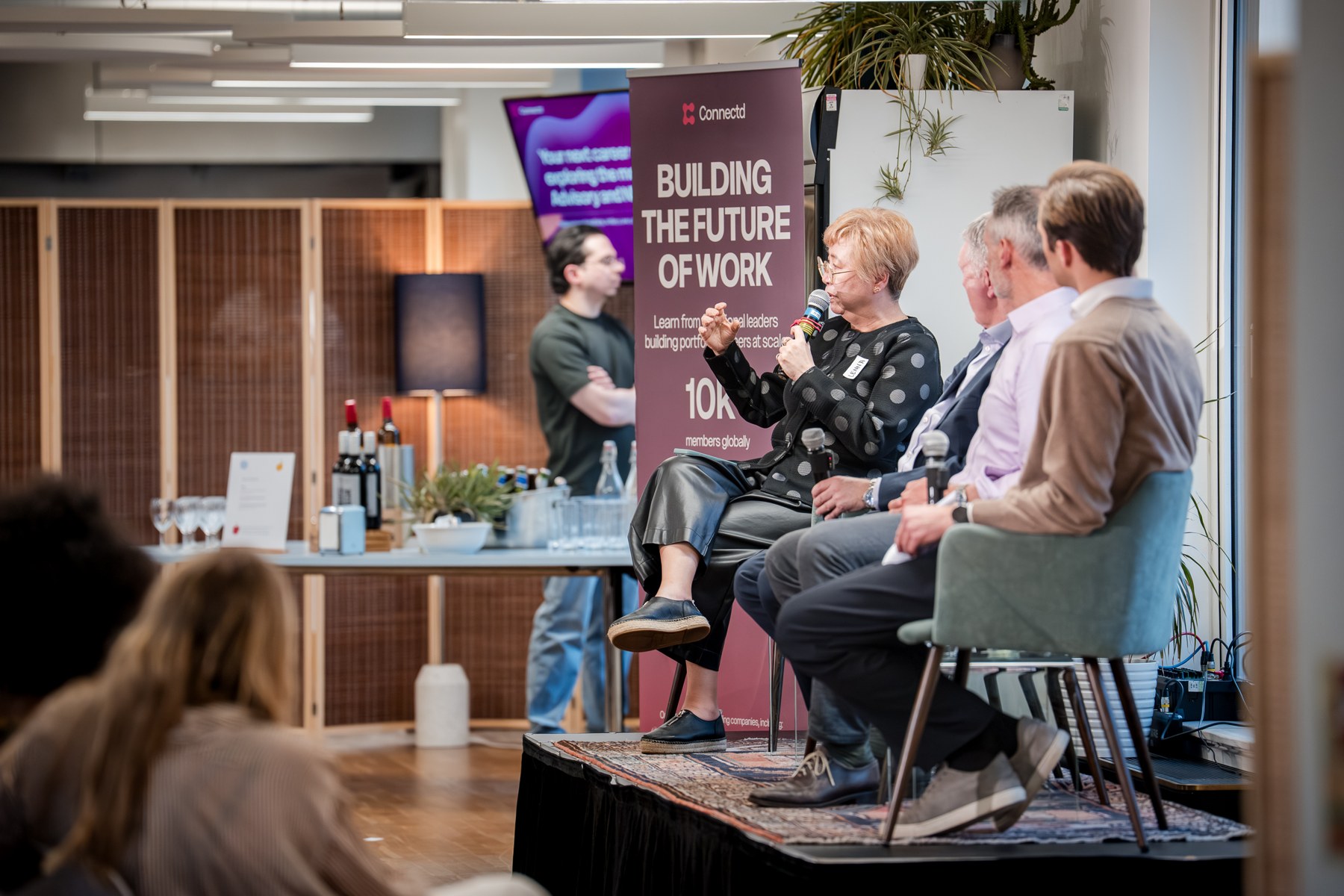 Wide view of Connectd panel and audience · Connectd